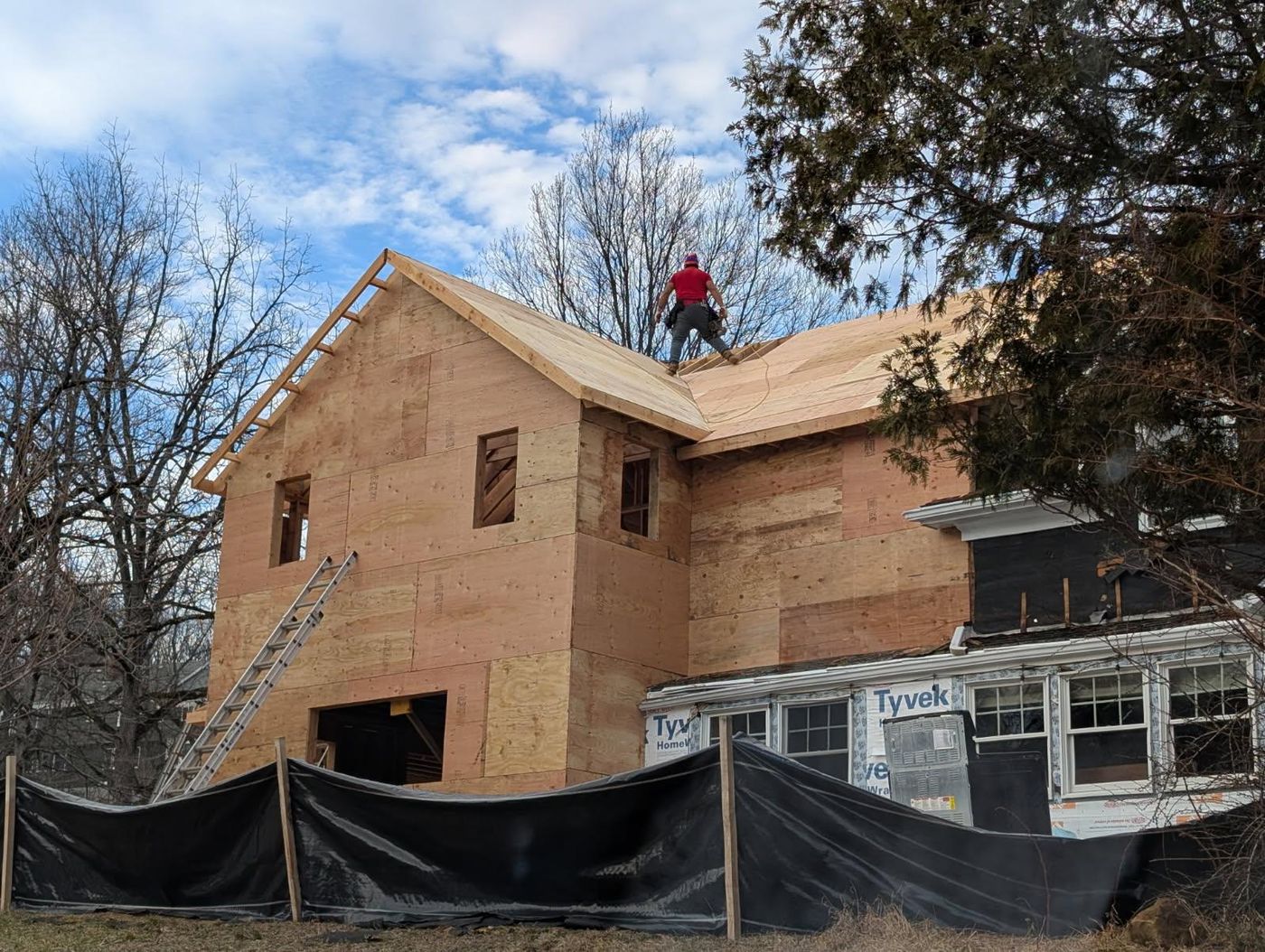 Second-story addition framed and sheathed on an existing home