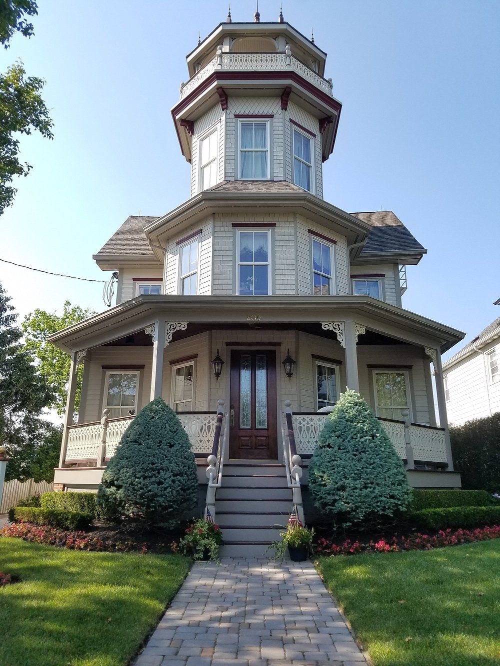 Victorian home with a wraparound porch and turret